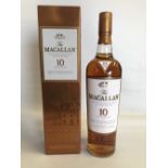 A bottle of Macallan Highland single malt Scotch whisky, ten years old.