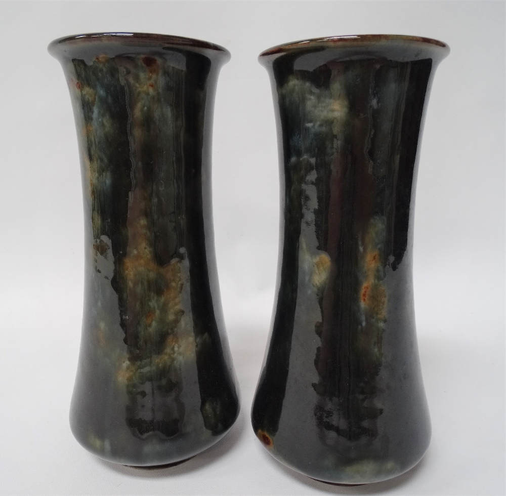 A pair of Royal Doulton stoneware cylindrical vases with dark green mottled ground No.7733D,