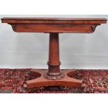 A mid 19th century rosewood card table with swivel top, turned column support and platform base.