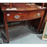 An early 19th century mahogany bow front side table fitted a single drawer on square tapering
