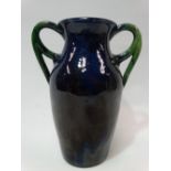 A late 19th century stoneware pottery twin handled vase with blue and green glaze, height 24cm.