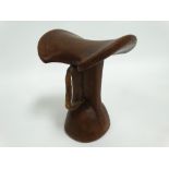 An African tribal Turkana headrest with leather strap handle, height 17.5cm.