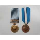 Two United Nations medals, one for Korea, the other In The Service Of Peace (2).