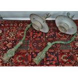 A pair of early 20th century cast metal 'swan neck' bracket street lamps by Bleeco of Brighton, with