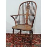 A good 19th century yew and elm Windsor armchair of typical form with H stretcher.