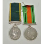 A WWII unattributed Territorial Army medal, together with a WWII Defence medal (2).