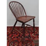 A hoop and stickback Windsor chair with shaped slab seat, turned legs with H stretcher, possibly