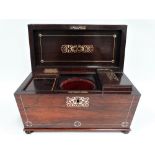 A William IV rosewood mother of pearl inlaid sarcophagus form tea caddy, the hinge lid enclosing two