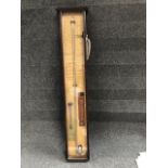 A 19th century Admiral Fitzroy's barometer of traditional form housed in a stained hardwood case,