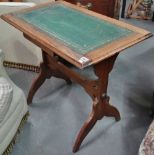 An early 20th century oak and leather topped occasional table of rectangular form.