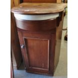 A hardwood and ceramic ship's wash basin of traditional form with cupboard below, width 54cm.