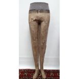 A pair of early 20th century papier mache tailor's dummy legs, height 112cm, together with a smaller