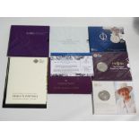 Seven Royal Mint £5 commemorative cased coins.