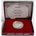 An American silver proof half dollar.