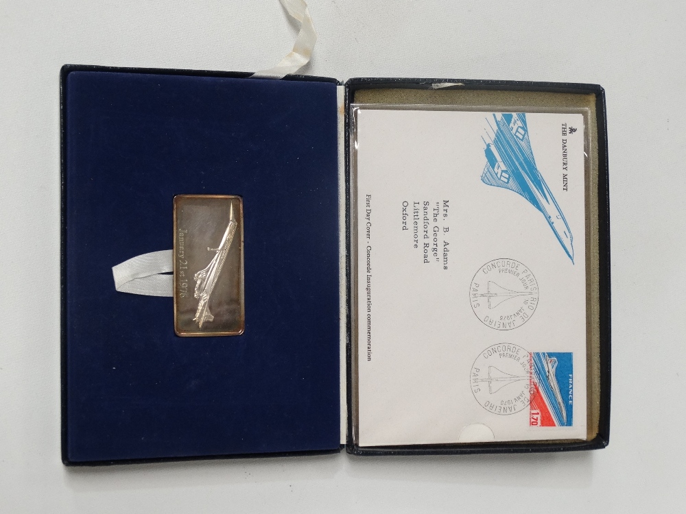 A Danbury Mint silver Concorde ingot and first day cover dated January 13 1976.