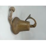 A bronze ship's bell with hinged mount, height 22cm.