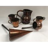 Copper wares, to include a jug, height 19cm, three mugs and two pans.
