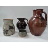 Four studio pottery wares, including a Truro Pottery vase with floral brushwork decoration upon an