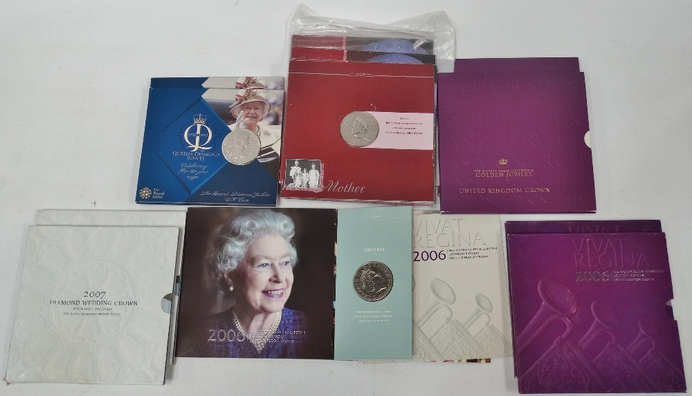 Eleven commemorative £5 coin sets, including Diamond Wedding, Diamond Jubilee etc.