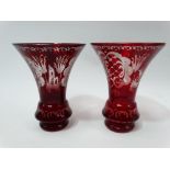 A pair of 19th century bohemian glass ruby overlay wheel engraved vases, height 15cm.