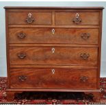 A small George III style mahogany chest of five drawers fitted with bone escutcheons and brass