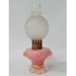 A white opaque and pink air twist glass oil lamp base applied with prunts and on an outswept clear