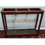 An Edwardian mahogany stickstand with tin drain trays, width 94cm.