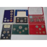 A quantity of foreign coin sets, including USA 1971.