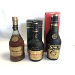 A bottle of Courvoisier VSOP cognac, together with a bottle of Camus cognac and a bottle of