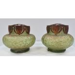 A pair of Loetz style green iridescent glass flower vases with bronzed pewter mounts, height 8cm.