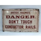 A GWR enamel on metal sign 'BRITISH RAILWAYS DANGER. DON'T TOUCH CONDUCTOR RAILS.', 32 x 51cm.