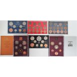 A collection of UK coin sets, including 1970 & 1980.
