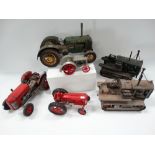 Six tin plate tractor models.