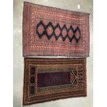 Two modern middle eastern hand knotted wool rugs, the largest 141 x 97cm.