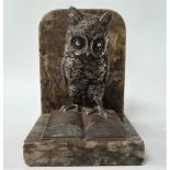 A silvered spelter owl and book modelled bookend upon an alabaster stand, height overall 14cm.