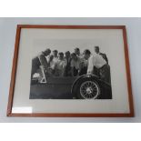 Brian Trubshaw, a photograph of himself and colleagues inspecting a car, his personal Caterham.