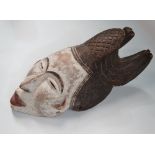 An African tribal carved and painted wood mask, height 37cm.