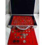 A contemporary coin case containing various British and foreign coins, including silver.