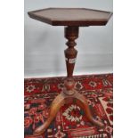 A walnut candle stand in the early 18th century manner on tripod base.