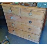 A 19th century stripped pine chest of five drawers, width 103cm.