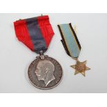 A WWI Faithful Service medal awarded to Frederick Laity, together with a WWII miniature medal for