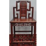 A 19th century Chinese hardwood side chair, the back decorated with a panel of bamboo above a