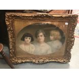 An early 20th century portrait group depicting a lady and two daughters, colour pastel on canvas