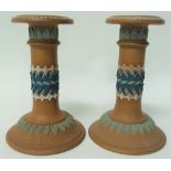 A pair of Doulton Silicone earthenware candlesticks with sprigged decoration, height 15cm.