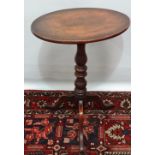 A mid 19th century mahogany pedestal occasional table on tripod base.