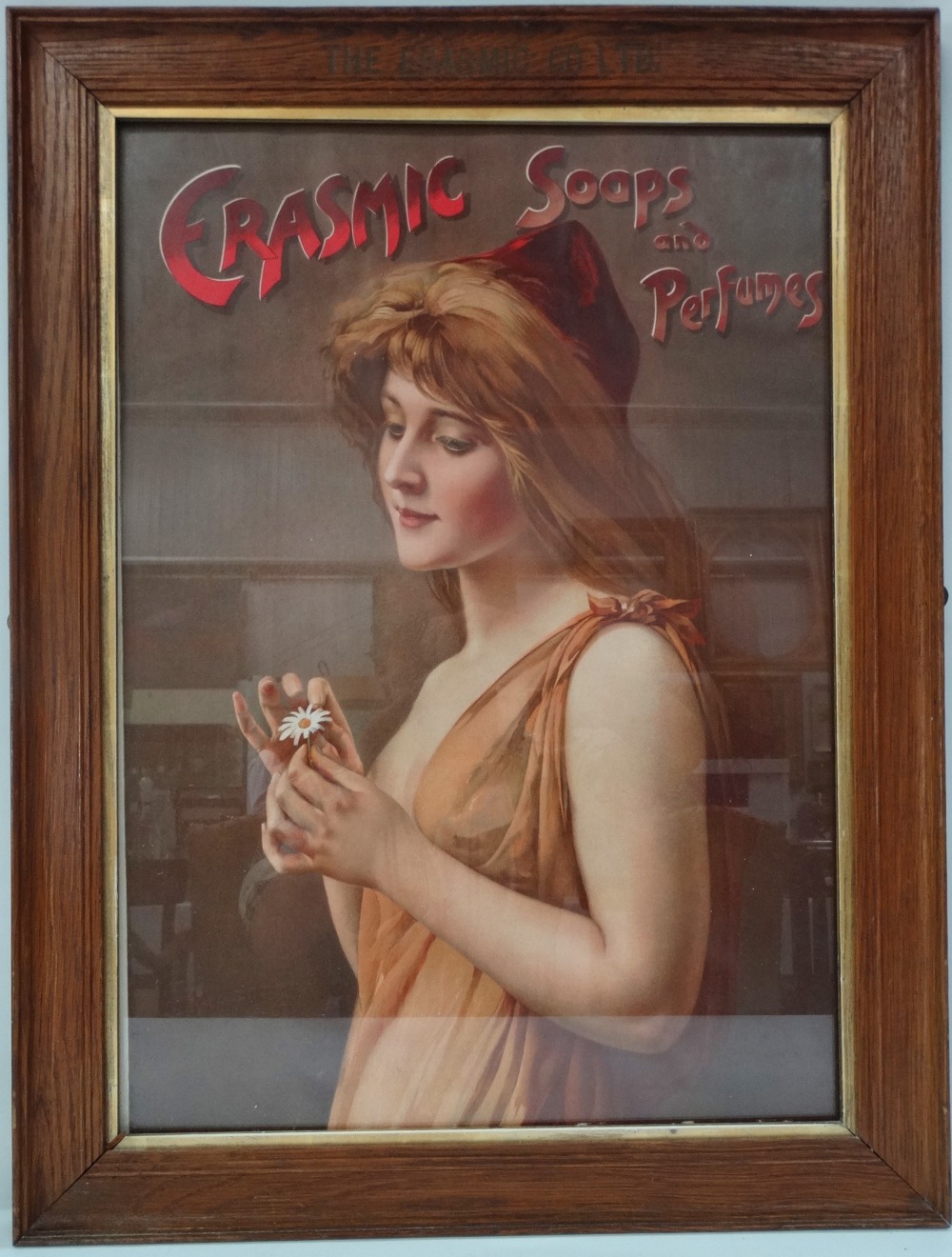 An early 20th century oak framed advertising frame and print, the oak frame stamped THE ERASMIC CO