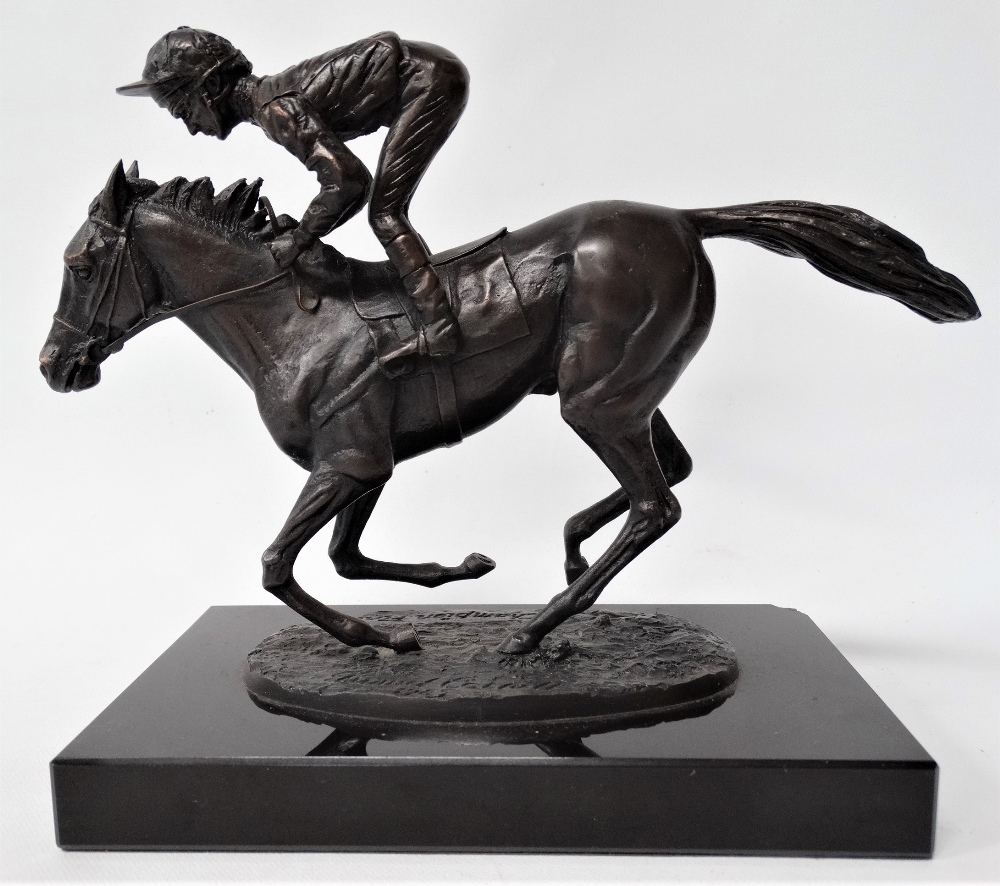 A modern bronze group upon black marble stand after David Cornell 'Champion Finish' depicting Lester