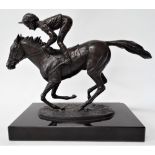 A modern bronze group upon black marble stand after David Cornell 'Champion Finish' depicting Lester