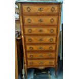 A late 19th century French tall chest of seven drawers fitted with a marble top in mid 18th