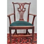 A late 18th century country armchair in the Chippendale style.